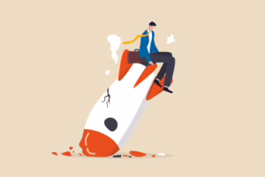 Frustrated man sitting on a crashed rocket, symbolizing the failure of a hosted LMS platform
