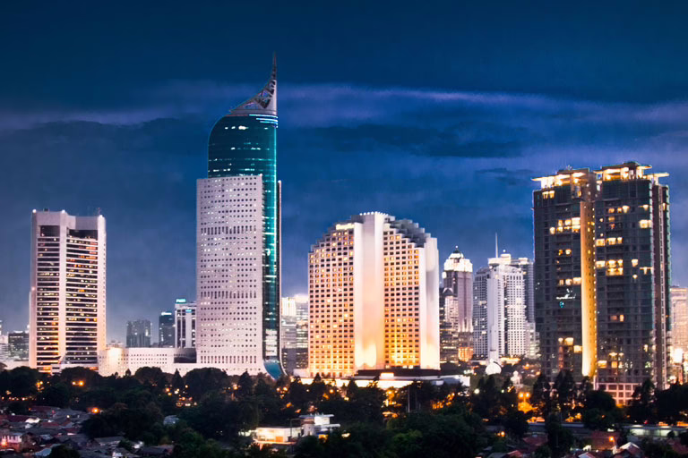 Hosting for Businesses Expanding to Indonesia – Jakarta Skyline Jakarta skyline at sunset, ideal image for hosting for businesses expanding to Indonesia
